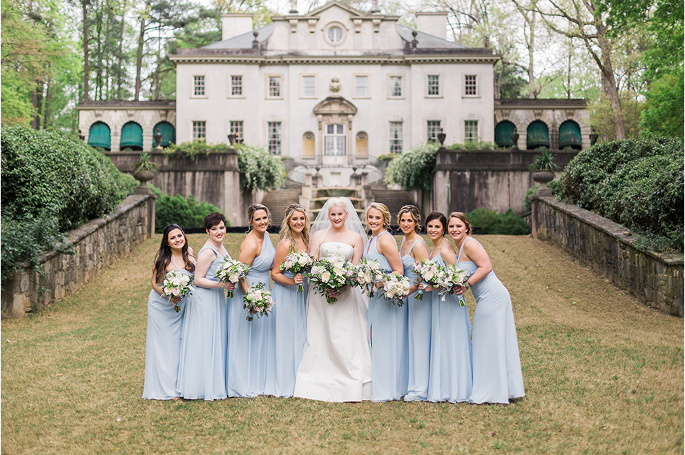 bride and bridesmaids posed in front of The Swan House at Atlanta History Center